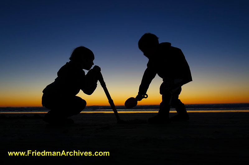 ocean,sunset,orange,water,beach,silhouette,digging,treasures,shovel,clams,shells,children,